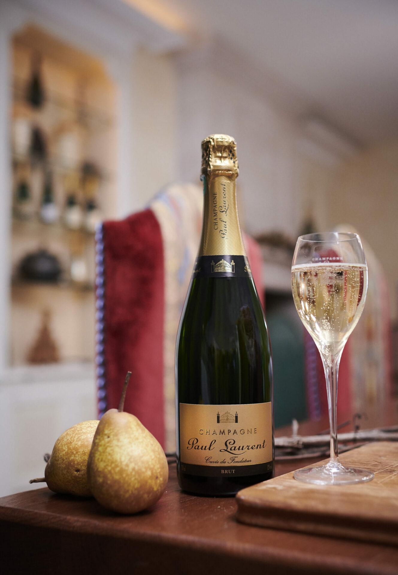 Bottle of Brut with pear and flute